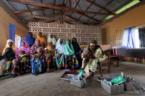 Traditional birth attendants (TBAs): Traditional birth attendants (TBAs) are vitally important in providing safe and healthy deliveries for women and their new babies. In a clinic in a nomadic community near Yola, Nigeria, a TBA lectures a group of women on the various components of their delivery kits, which are used to facilitate healthy births.
